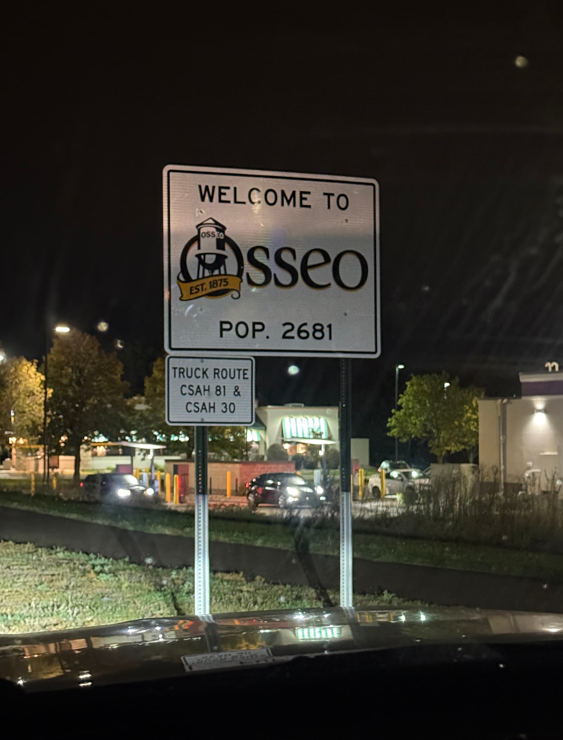 Movers in Osseo by its city sign